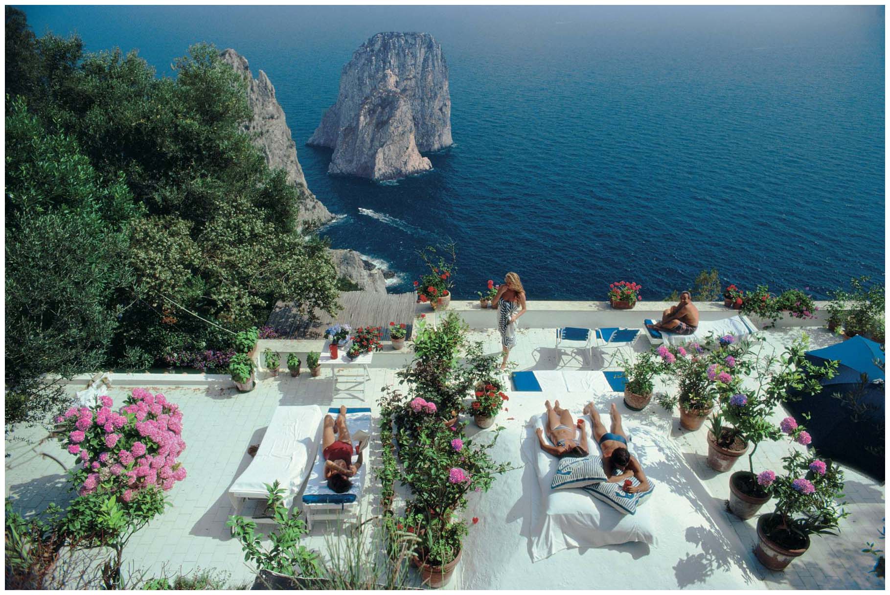 Photo by Slim Aarons via Pleasurephoto.  The view from the terrace of Il Canile, a villa owned by Umberto Tirelli and Dino Trappetti.